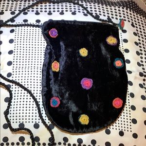 Velvet pouch with macramé flowers made in India